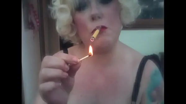 HD A Blonde Retro Mistress Smoking A Yellow Sobranie Cigarette With Match Light Up drive Movies